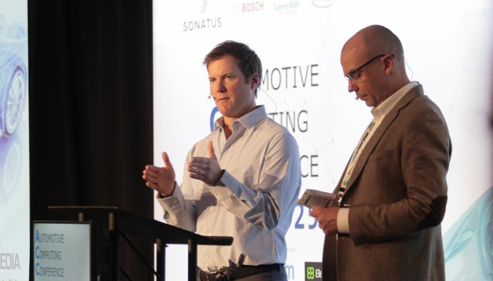 Brett Harrison (left) on stage in Detroit.