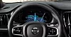 Volvo steering wheel with digital dashboard showing navigation map