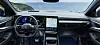 Renault car interior with digital dashboard and touchscreen facing a coastal landscape