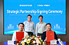 Four men pose at a signing ceremony with documents, flowers and Schaeffler and CATL branding on a blue backdrop.