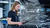 Woman holding a tablet beside a car with a ChatGPT graphic overlay.