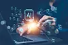 Hands using a laptop with glowing artificial intelligence symbols and digital data graphics overlaying the screen.